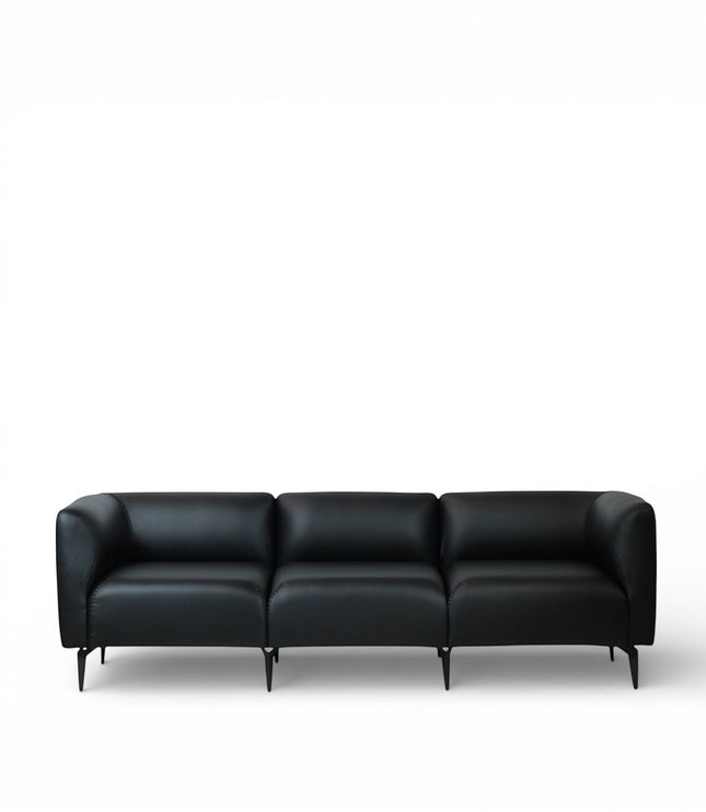 Front view of the Vaya Home Regalo sofa with black leather upholstery, segmented back cushions, and slim metal legs.
