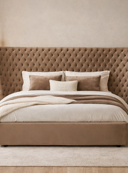 Vaya Home Regent upholstered bed in taupe fabric with a tufted wingback headboard, styled in a modern bedroom.