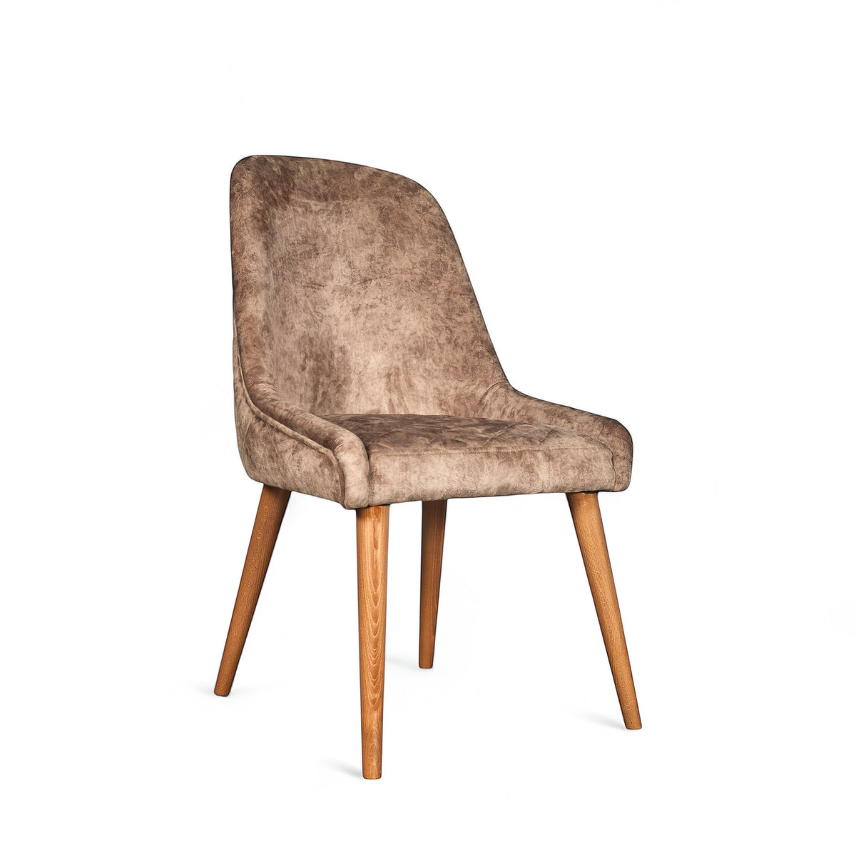 Front angled view of the Vaya Home Reverie dining chair in beige leather velvet upholstery with a cushioned seat and tapered wood legs.