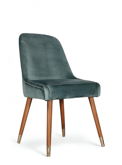 Front angled view of the Vaya Home Reverie dining chair with blue upholstery, cushioned seat, and tapered wood legs.