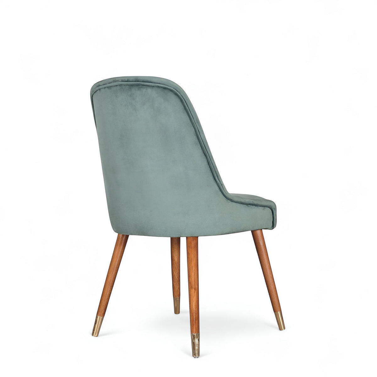 Rear angled view of the Vaya Home Reverie dining chair featuring blue upholstery and tapered wood legs.