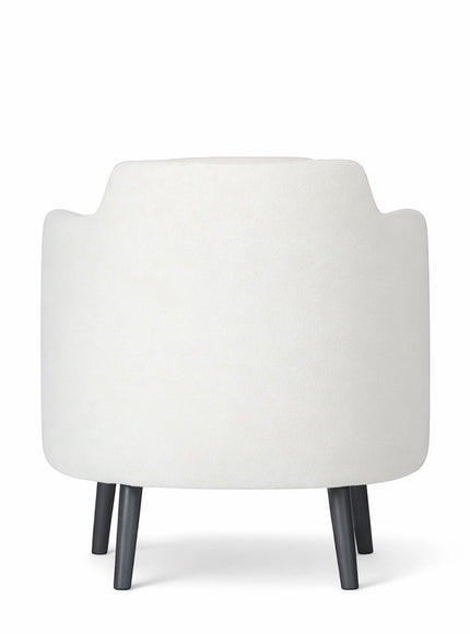 Back view of the Vaya Home Ribbon accent chair featuring ivory upholstery and black tapered legs.