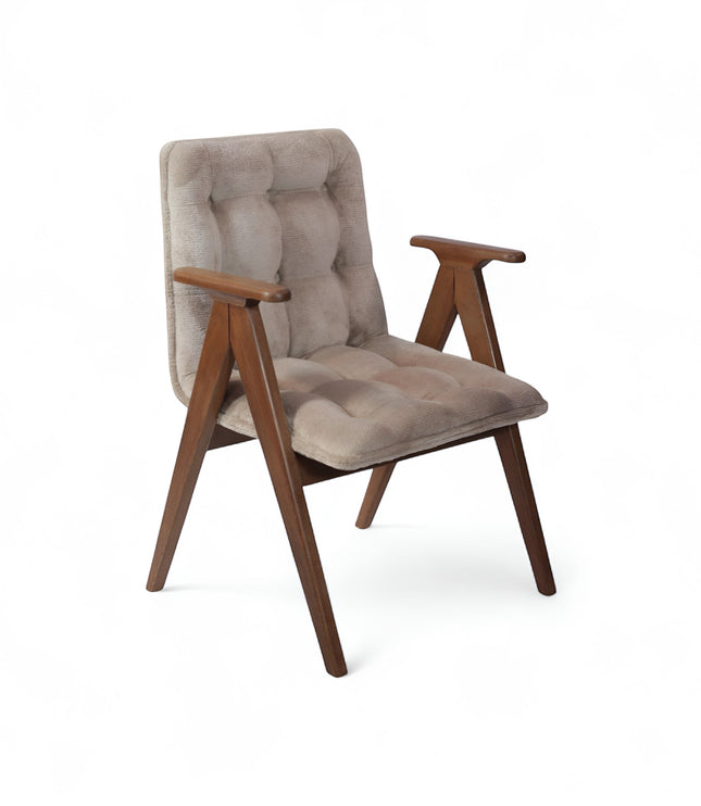 Product view of the Vaya Home Riposo accent chair in beige tufted upholstery with sculpted wood arms and angled wood legs.