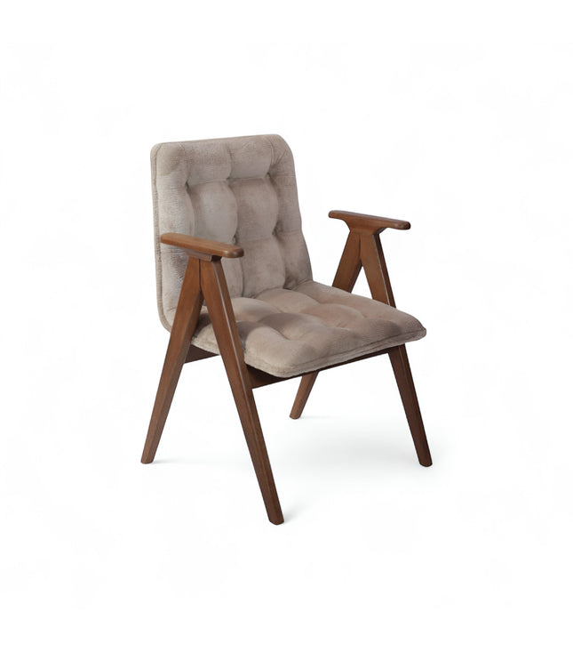 Product view of the Vaya Home Riposo accent chair in beige tufted upholstery with sculpted wood arms and angled wood legs.
