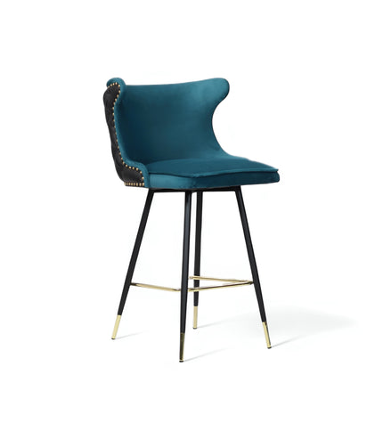 Product view of the Vaya Home Roket bar stool in blue and black upholstery with a tufted back and black metal legs with gold accents.