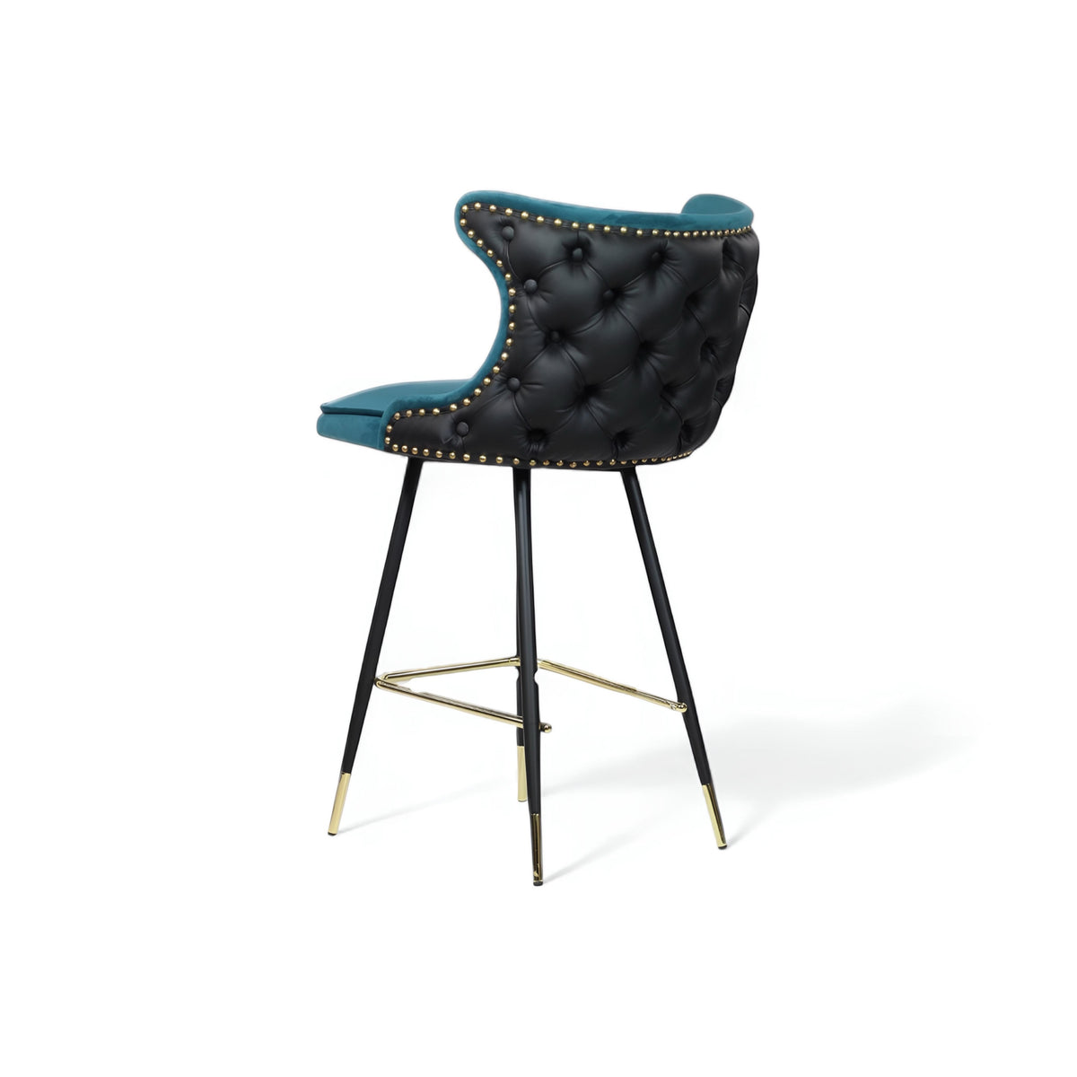 Rear angled view of the Vaya Home Roket bar stool with black tufted upholstery, blue trim, nailhead detailing, and black metal legs with gold accents.