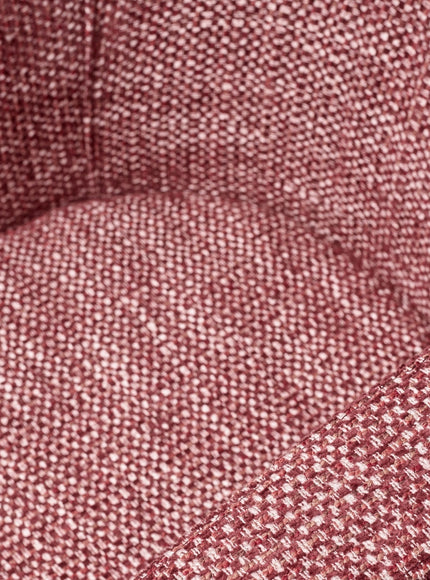 Close-up of the Vaya Home Roxy accent chair showing rose textured fabric and upholstered seat detail.