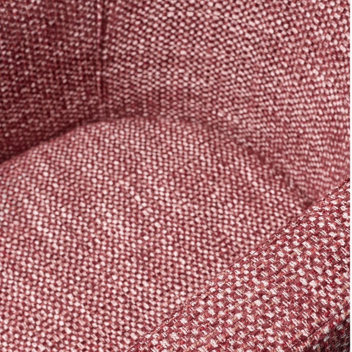 Close-up of the Vaya Home Roxy accent chair showing rose textured fabric and upholstered seat detail.