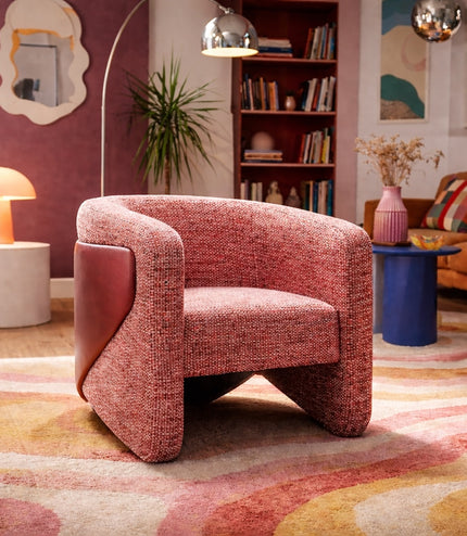 Vaya Home Roxy accent chair in rose textured upholstery, styled in a colorful modern living room.