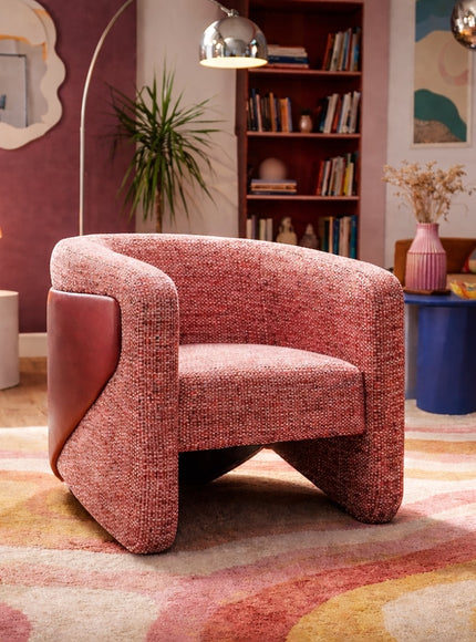 Vaya Home Roxy accent chair in rose textured upholstery, styled in a colorful modern living room.