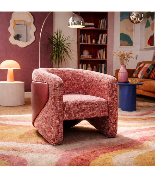 Vaya Home Roxy accent chair in rose textured upholstery, styled in a colorful modern living room.