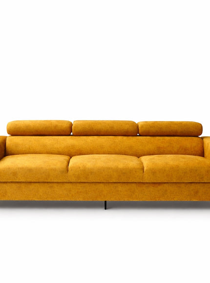 Front view of the Vaya Home Saffron modern sofa with mustard yellow upholstery, tufted seat cushions, and adjustable headrests in a lowered position.