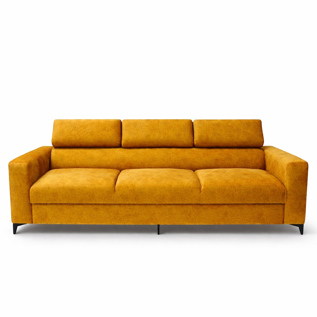 Front view of the Vaya Home Saffron modern sofa featuring mustard yellow upholstery, broad arms, and adjustable headrests in a raised position.