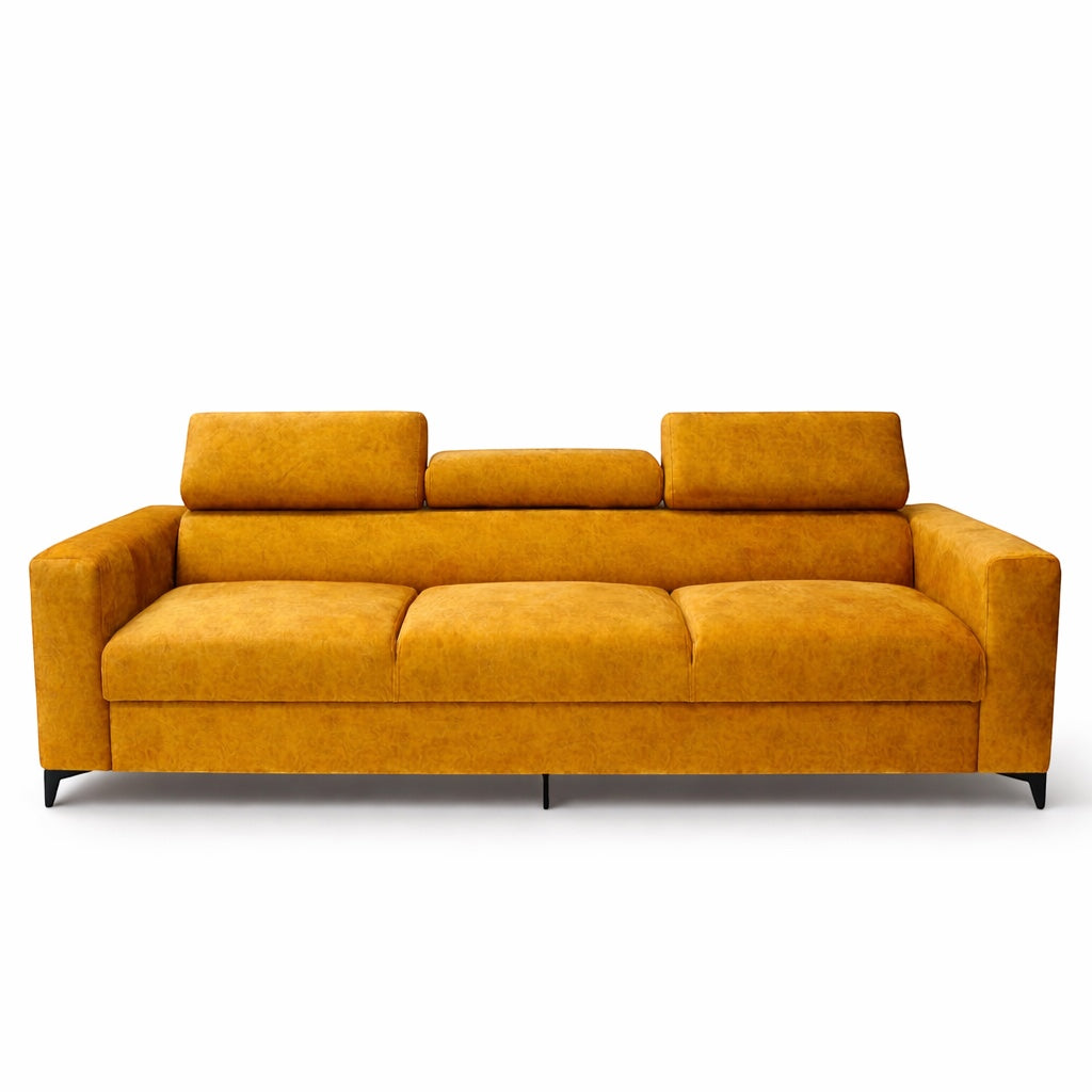 Angled front view of the Vaya Home Saffron sofa with mustard yellow upholstery, wide armrests, and adjustable headrests.