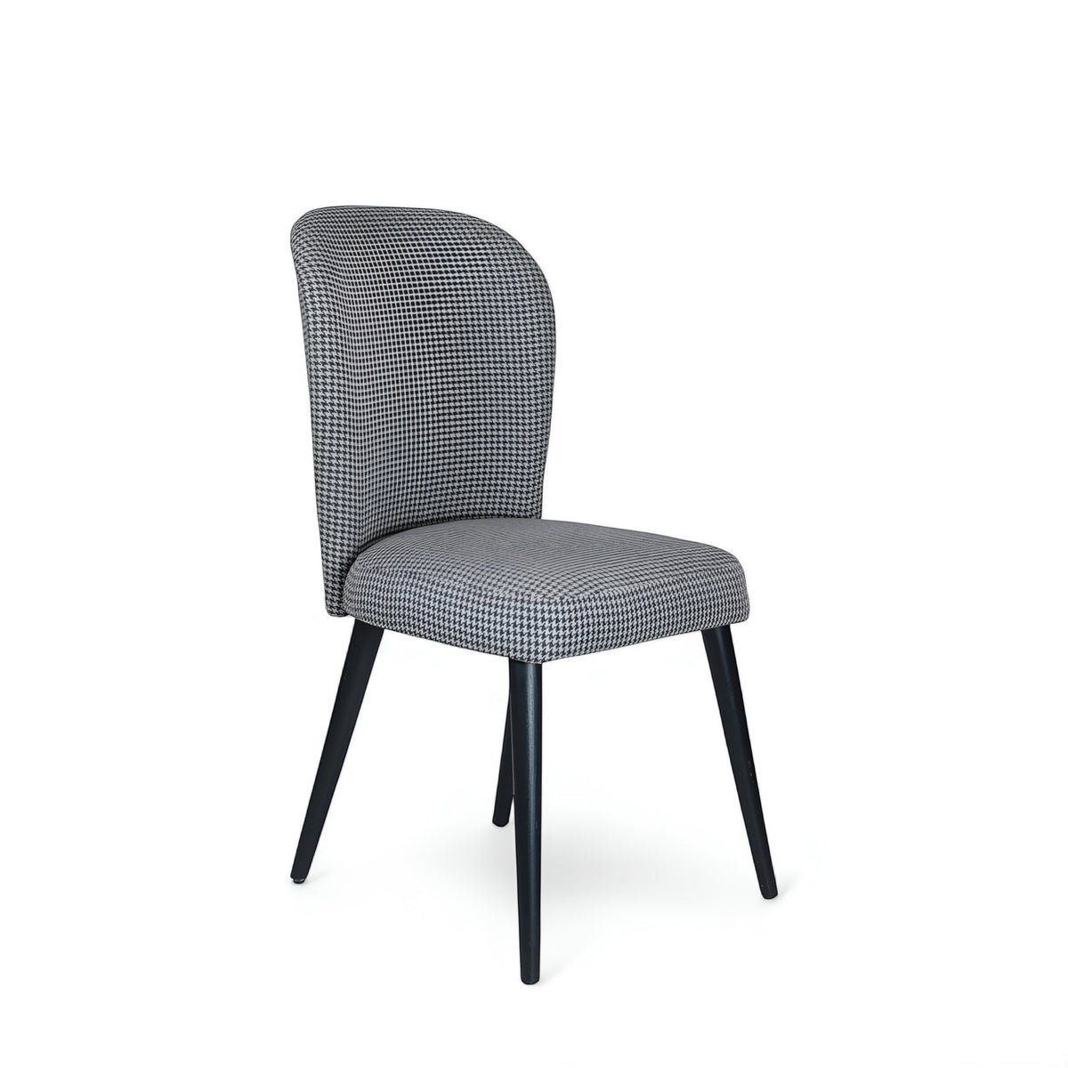Product view of the Vaya Home Scacchi dining chair in black and white houndstooth upholstery with black tapered legs.