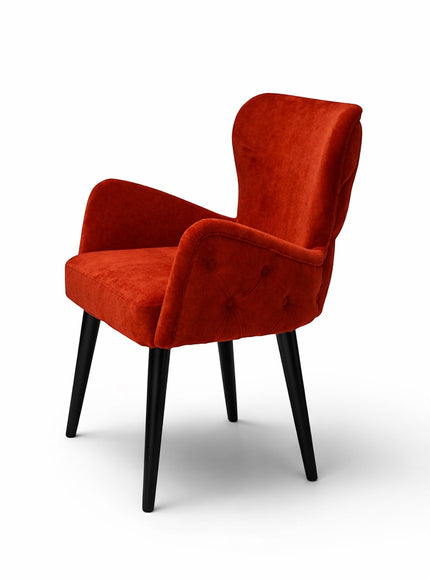 Vaya Home Sienna burnt orange velvet accent chair with button tufting and tapered black legs.