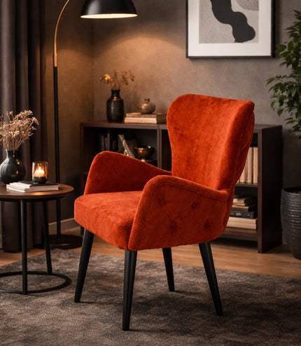 Vaya Home Sienna burnt orange velvet accent chair with button tufting and tapered legs.