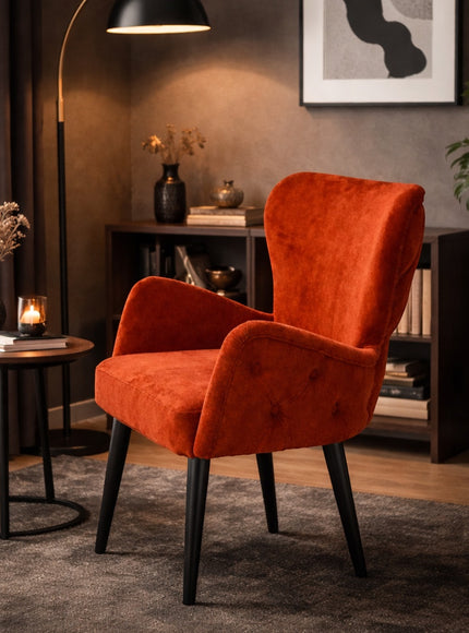 Vaya Home Sienna burnt orange velvet accent chair with button tufting and tapered legs.