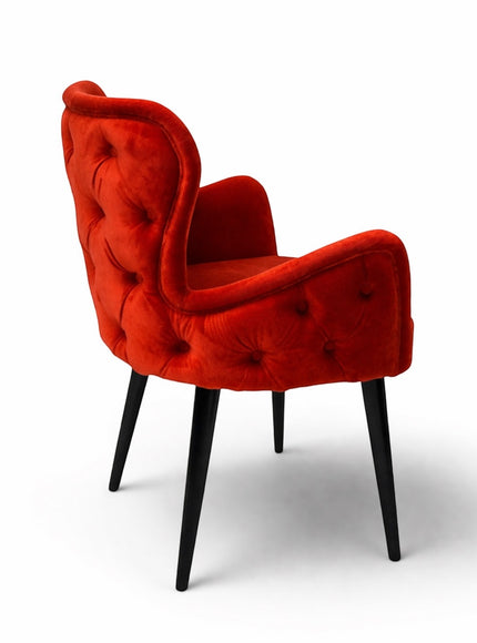 Vaya Home Sienna red velvet accent chair with button tufting and tapered black legs.