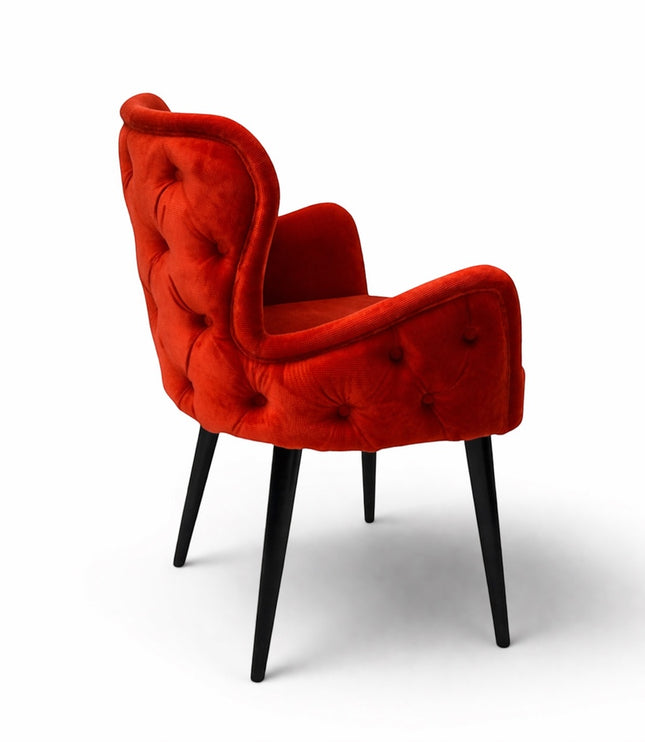 Vaya Home Sienna red velvet accent chair with button tufting and tapered black legs.