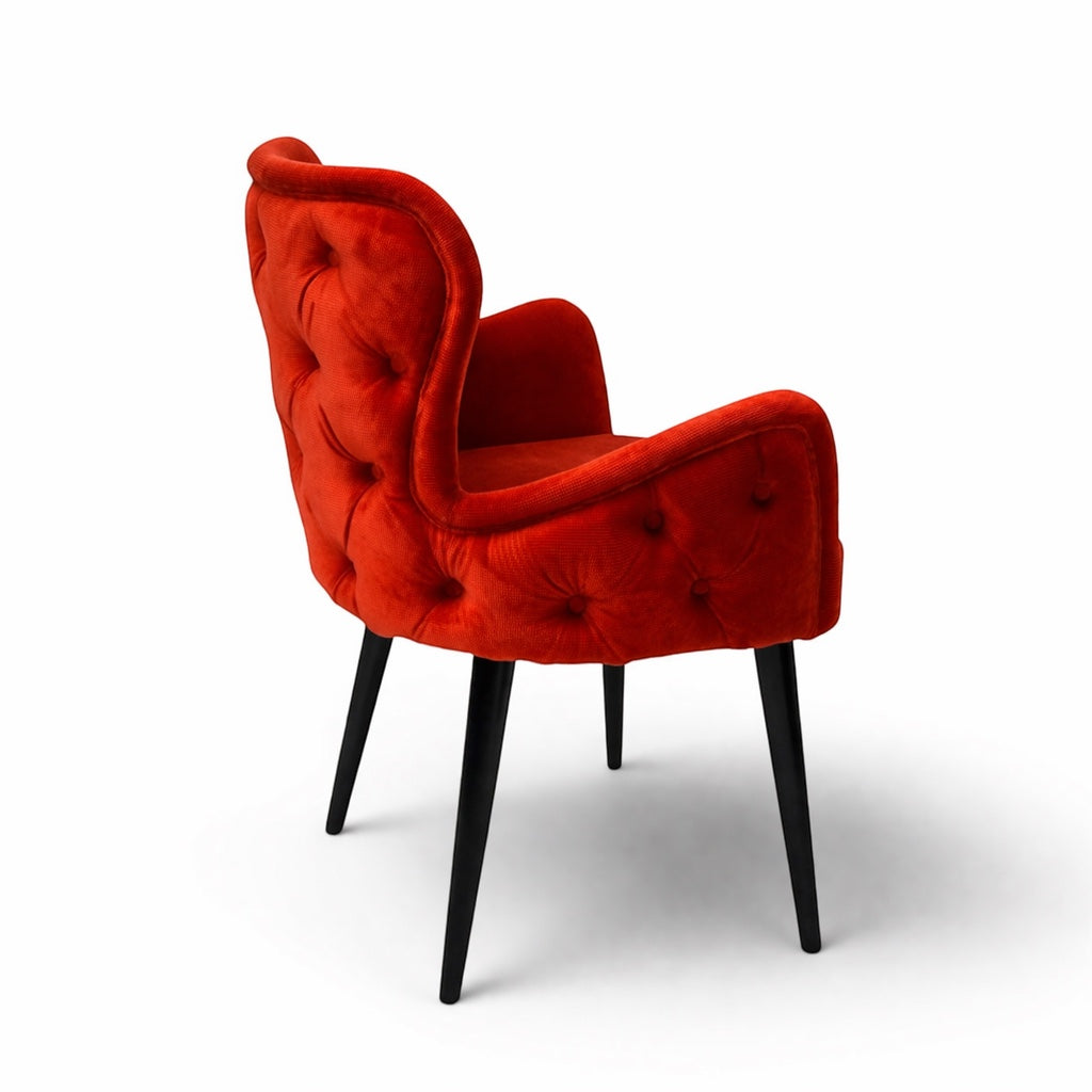 Vaya Home Sienna red velvet accent chair with button tufting and tapered black legs.