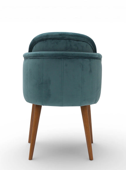 Back view of the Vaya Home Silver dining chair with blue upholstery and tapered wood legs.