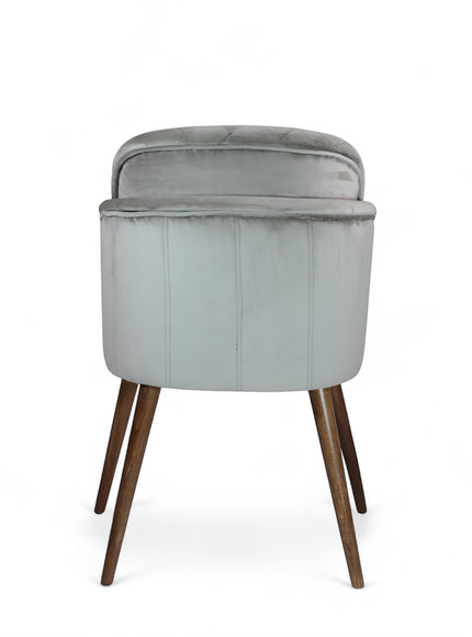 Back view of the Vaya Home Silver dining chair featuring gray upholstery and tapered wood legs.