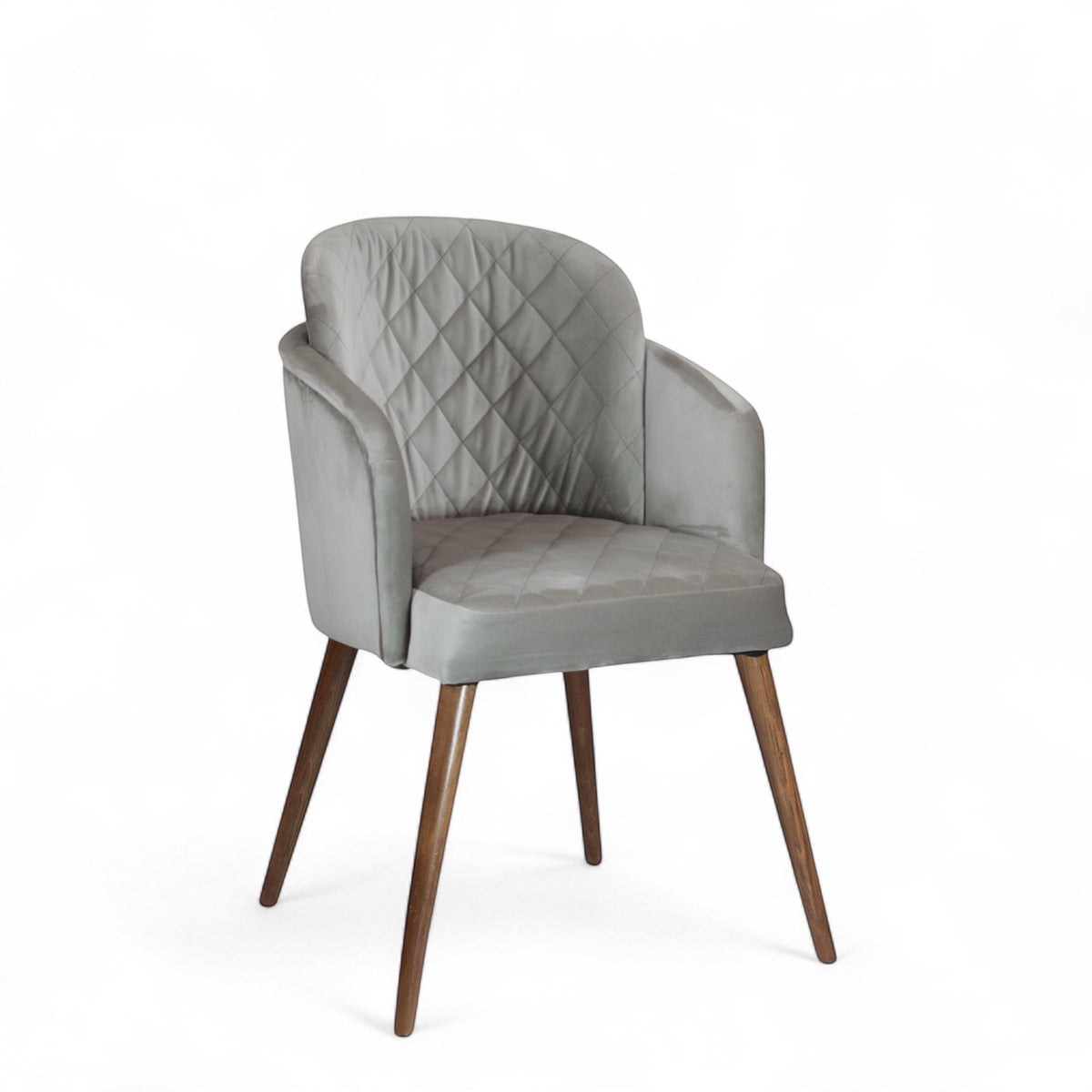 Product view of the Vaya Home Silver dining chair in gray upholstery with curved arms and tapered wood legs.