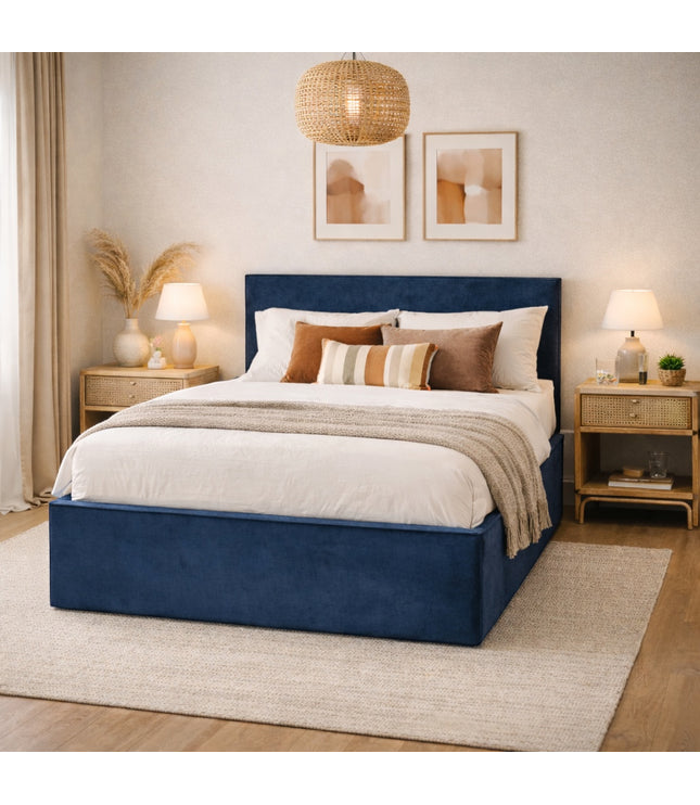 Vaya Home Soho upholstered bed in blue fabric, styled in a modern bedroom.