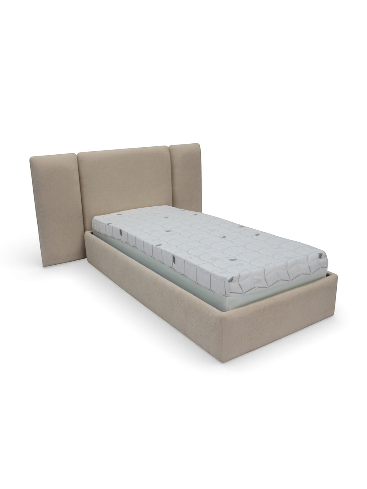 Angled view of the Vaya Home Sutton kids upholstered bed featuring beige fabric upholstery and a wingback headboard.
