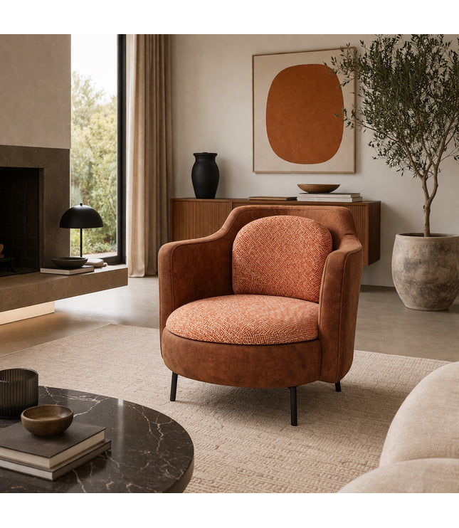 Vaya Home Terracotta armchair with rounded silhouette, brown eco-leather exterior, and orange geometric patterned upholstery.
