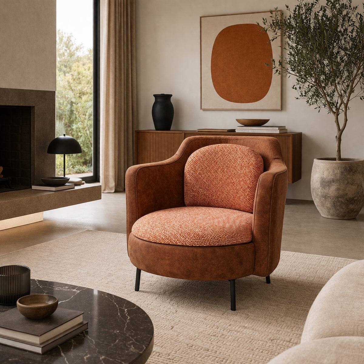 Vaya Home Terracotta armchair with rounded silhouette, brown eco-leather exterior, and orange geometric patterned upholstery.