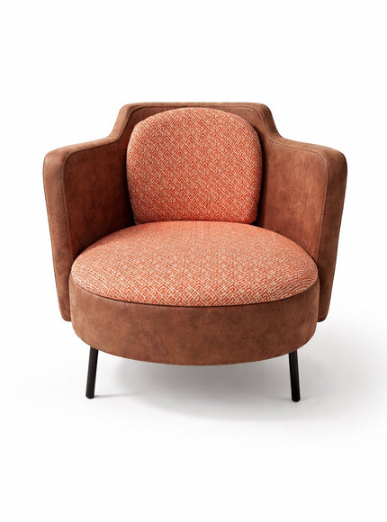 Vaya Home Terracotta armchair with rounded silhouette, brown eco-leather exterior, and orange geometric patterned upholstery.