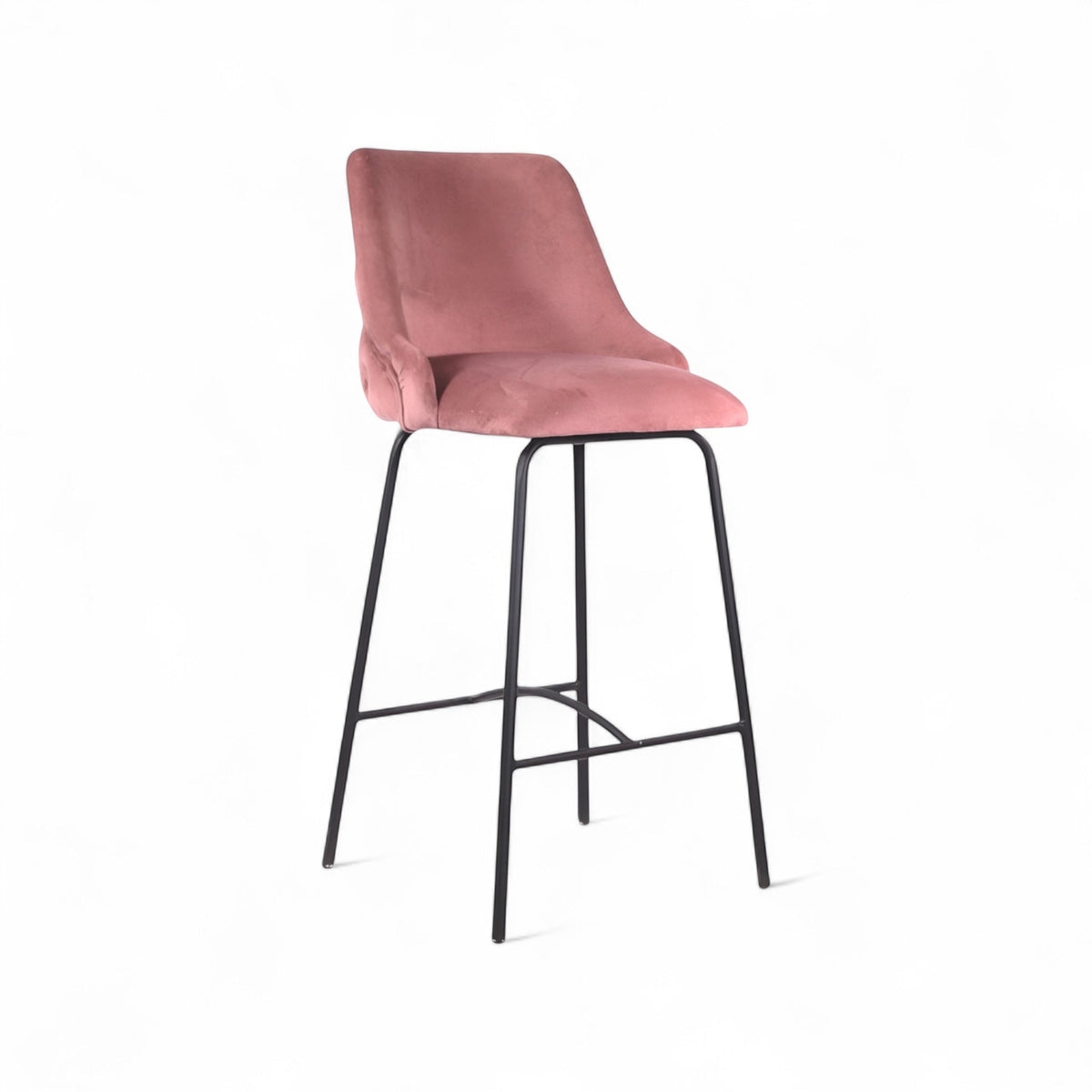 Front angled view of the Vaya Home Toffel bar stool with pink velvet upholstery, tufted backrest, and black metal legs.