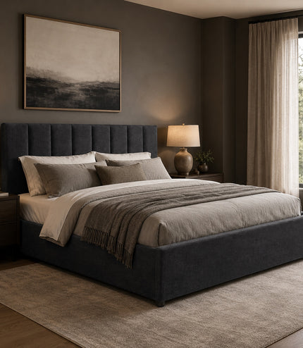 Vaya Home Torino upholstered platform bed in dark gray with a channel-tufted headboard, styled in a modern bedroom.