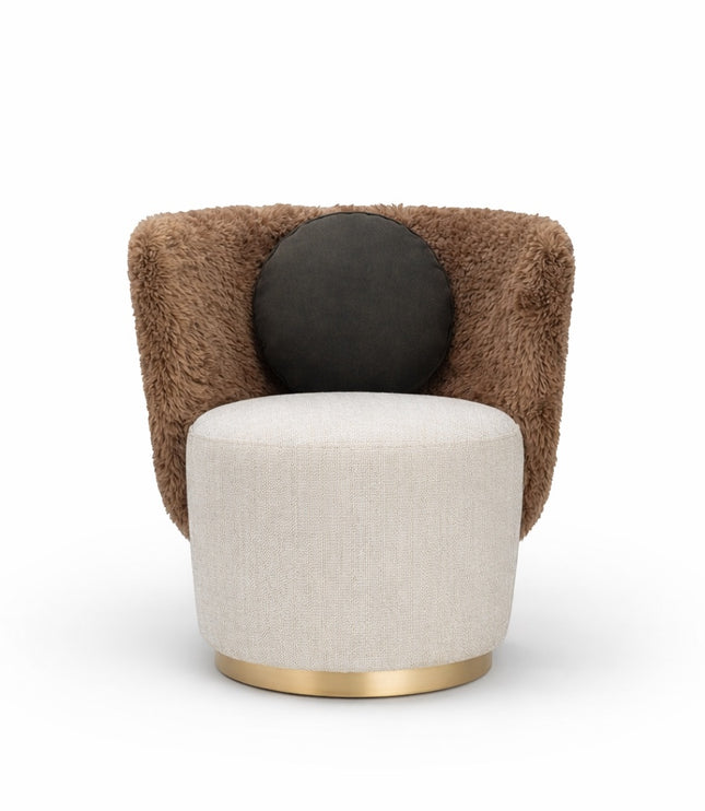 Front view of the Vaya Home Valmont accent chair with a cream upholstered seat, brown textured wraparound back, gold base trim, and black round cushion.