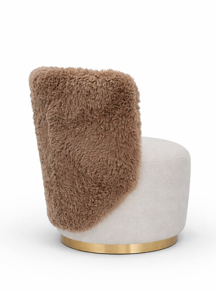 Side view of the Vaya Home Valmont accent chair showing a brown textured outer back, cream upholstered seat, and gold base trim.