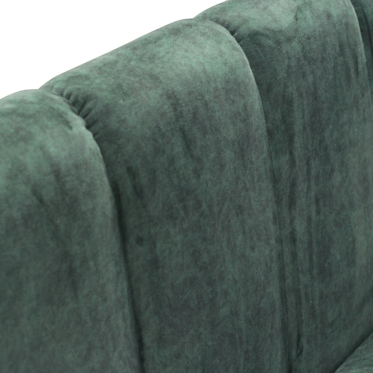 Close-up of the Vaya Home Vert loveseat showing deep green velvet upholstery and channel-tufted back detail.
