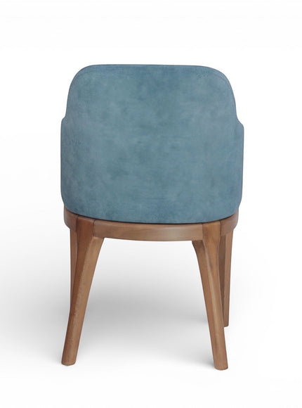 Back view of the Vaya Home Verve dining chair with blue upholstery and tapered wood legs.