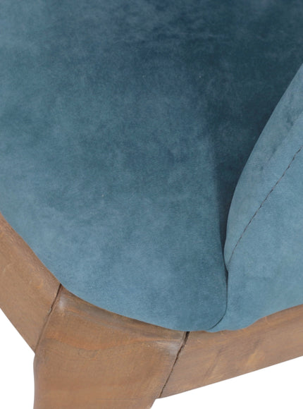 Close-up of the Vaya Home Verve dining chair showing blue upholstery and wood frame detail.