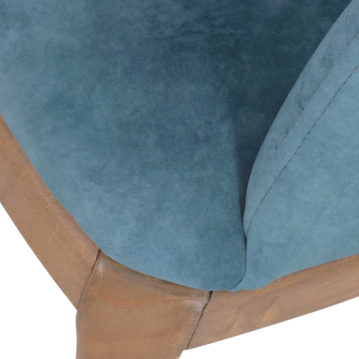 Close-up of the Vaya Home Verve dining chair showing blue upholstery and wood frame detail.