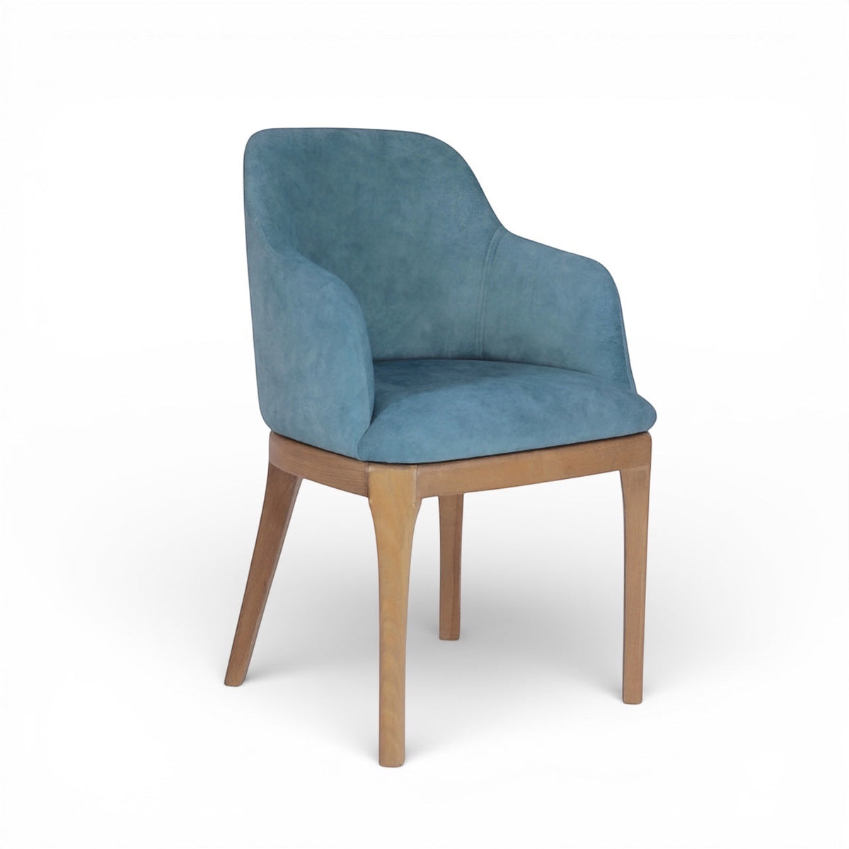Product view of the Vaya Home Verve dining chair in blue upholstery with curved arms and tapered wood legs.