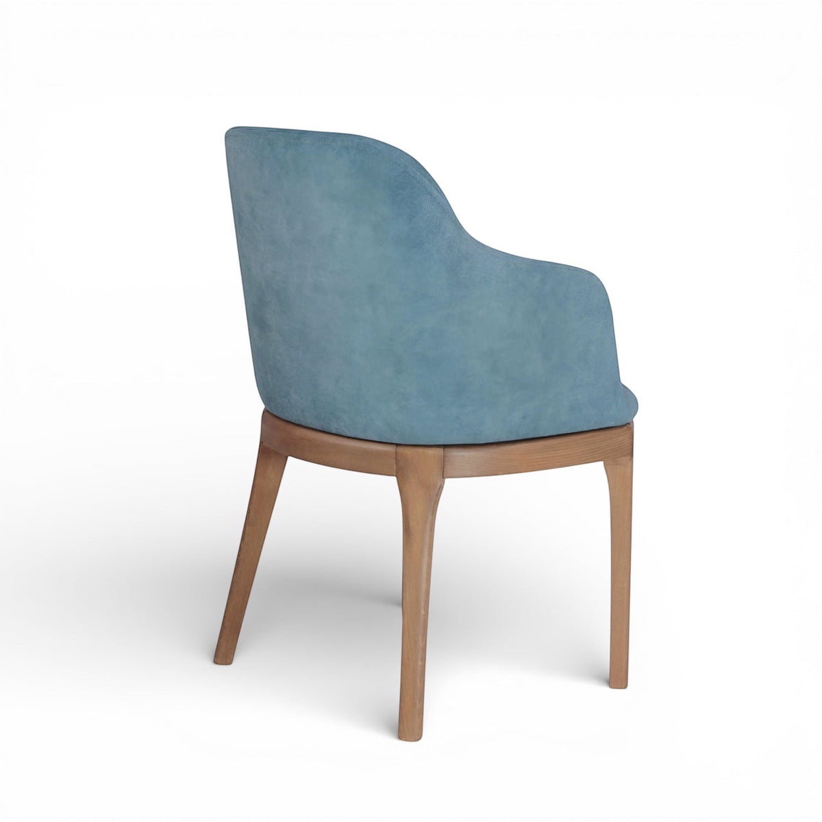 Rear angled view of the Vaya Home Verve dining chair featuring blue upholstery and tapered wood legs.