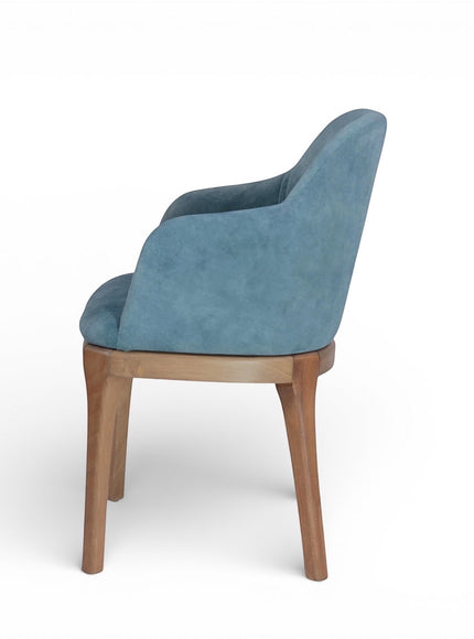 Side rear view of the Vaya Home Verve dining chair showing the curved upholstered back and tapered wood legs.