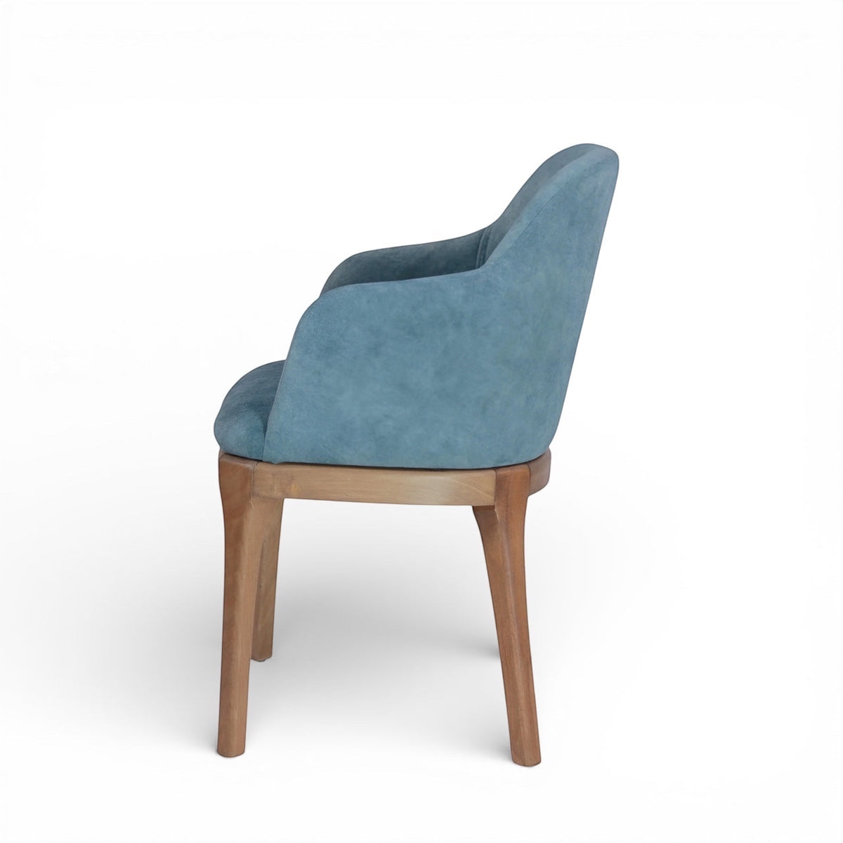 Side rear view of the Vaya Home Verve dining chair showing the curved upholstered back and tapered wood legs.