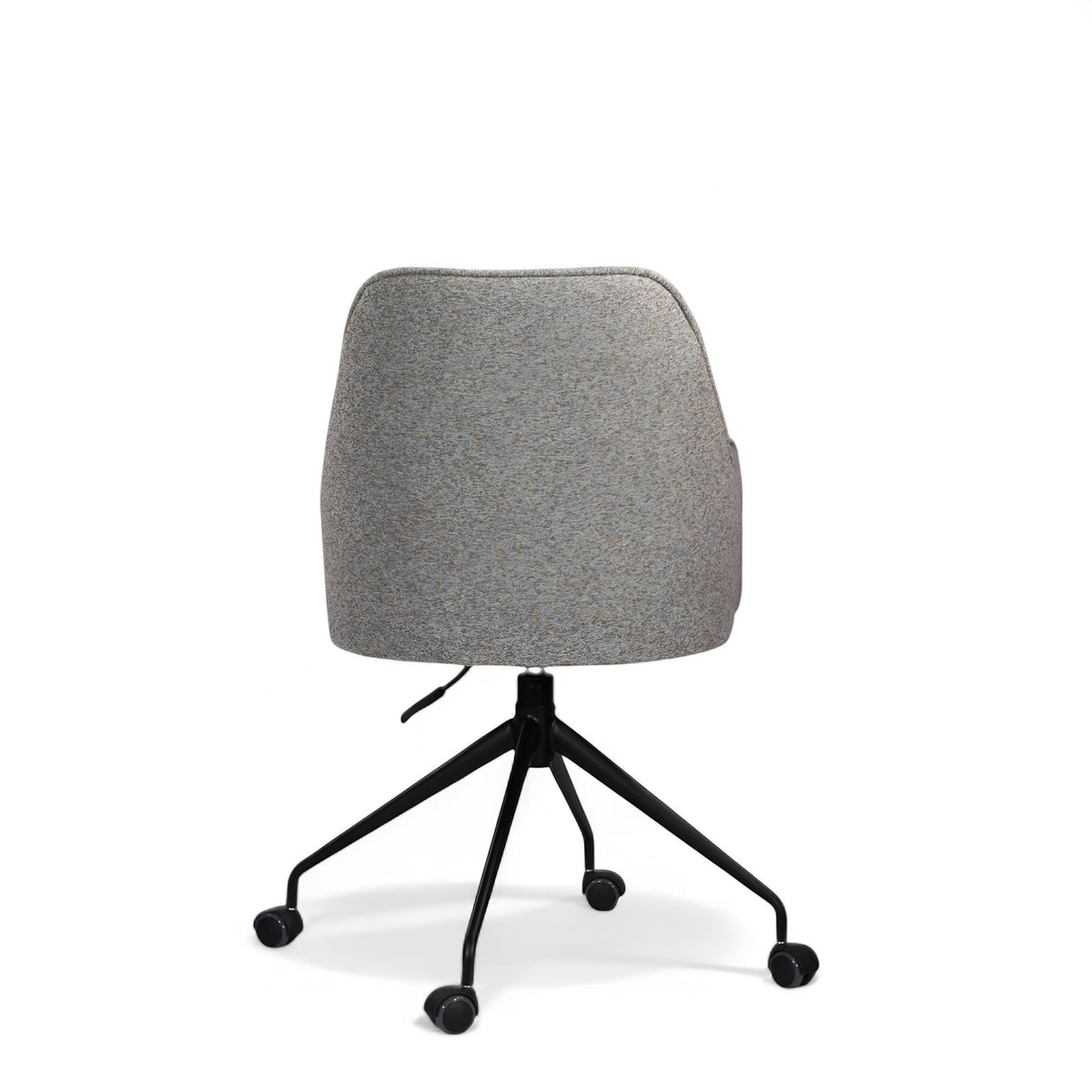 Back view of the Vaya Home Wicky swivel office chair with gray upholstery and a black rolling base.